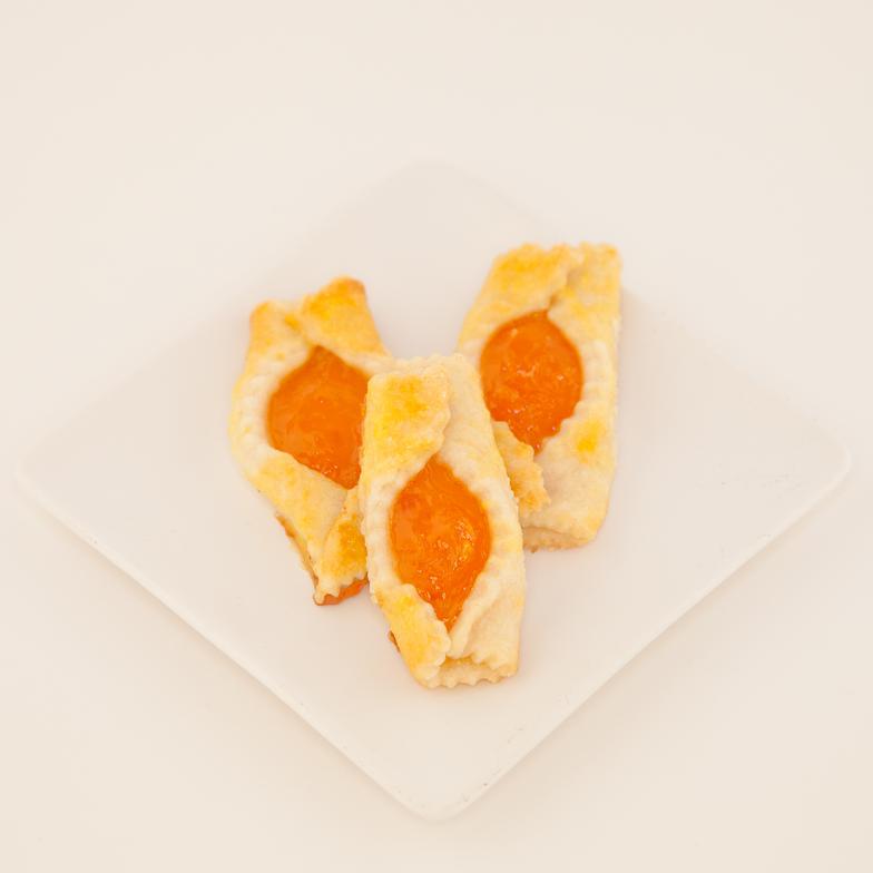 Buttery yeasty pastry cookie brimming with apricot filling 