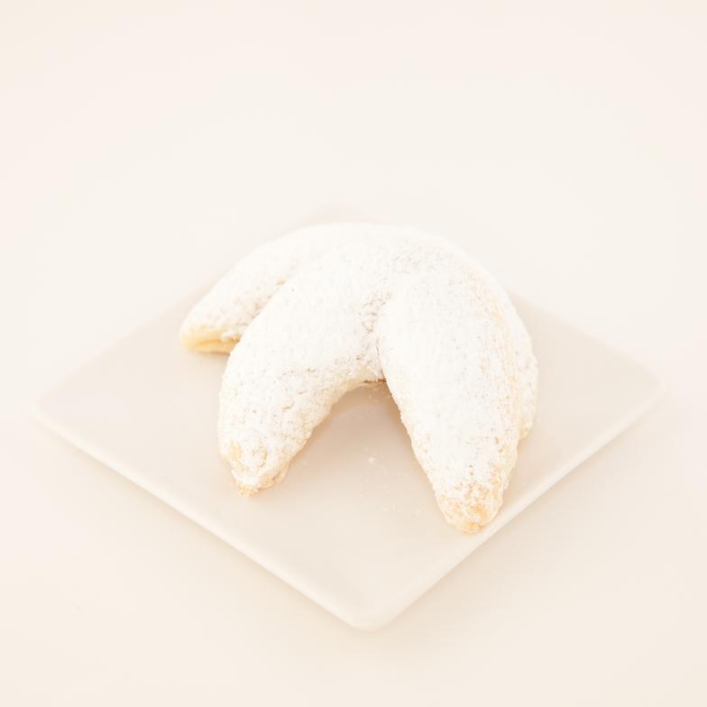 Meaning "little" nut roll in Hungarian, an individual version of our delicious kolachi, rolled in sugar and shaped into a large beautiful crescent 